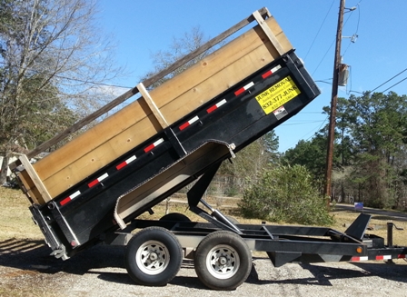 Junky Business mobile dumpster unit in up position